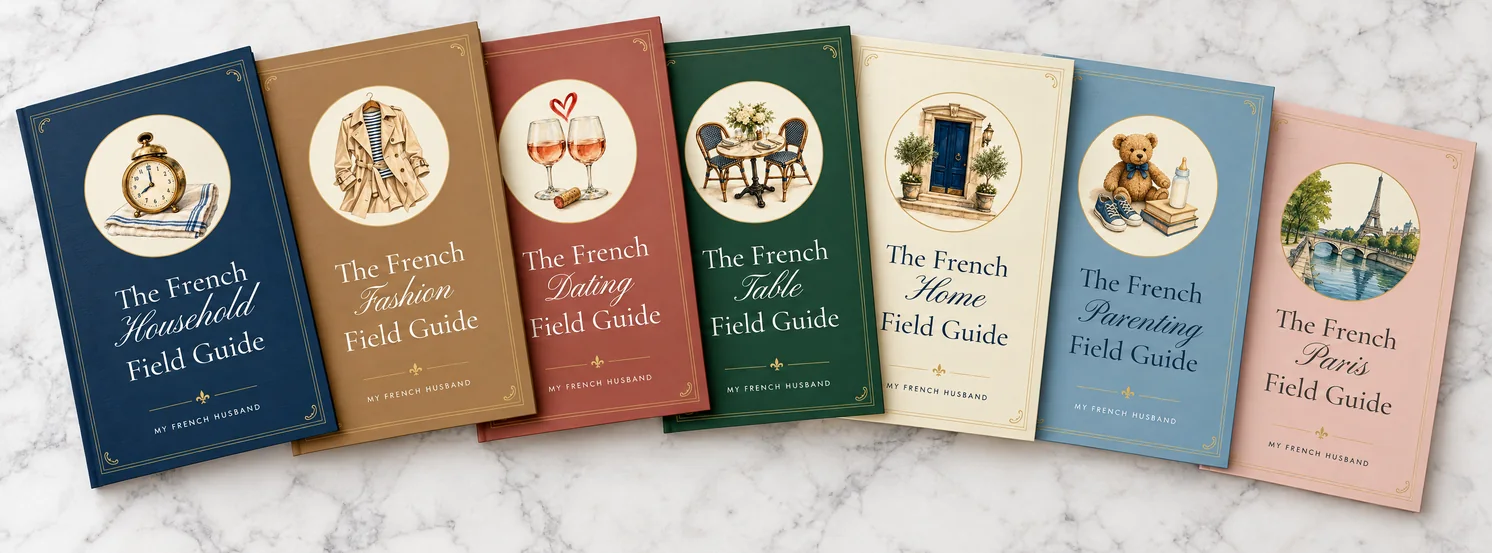 The seven guide covers fanned out on marble: Household, Fashion, Dating, Table, Home, Parenting and Paris